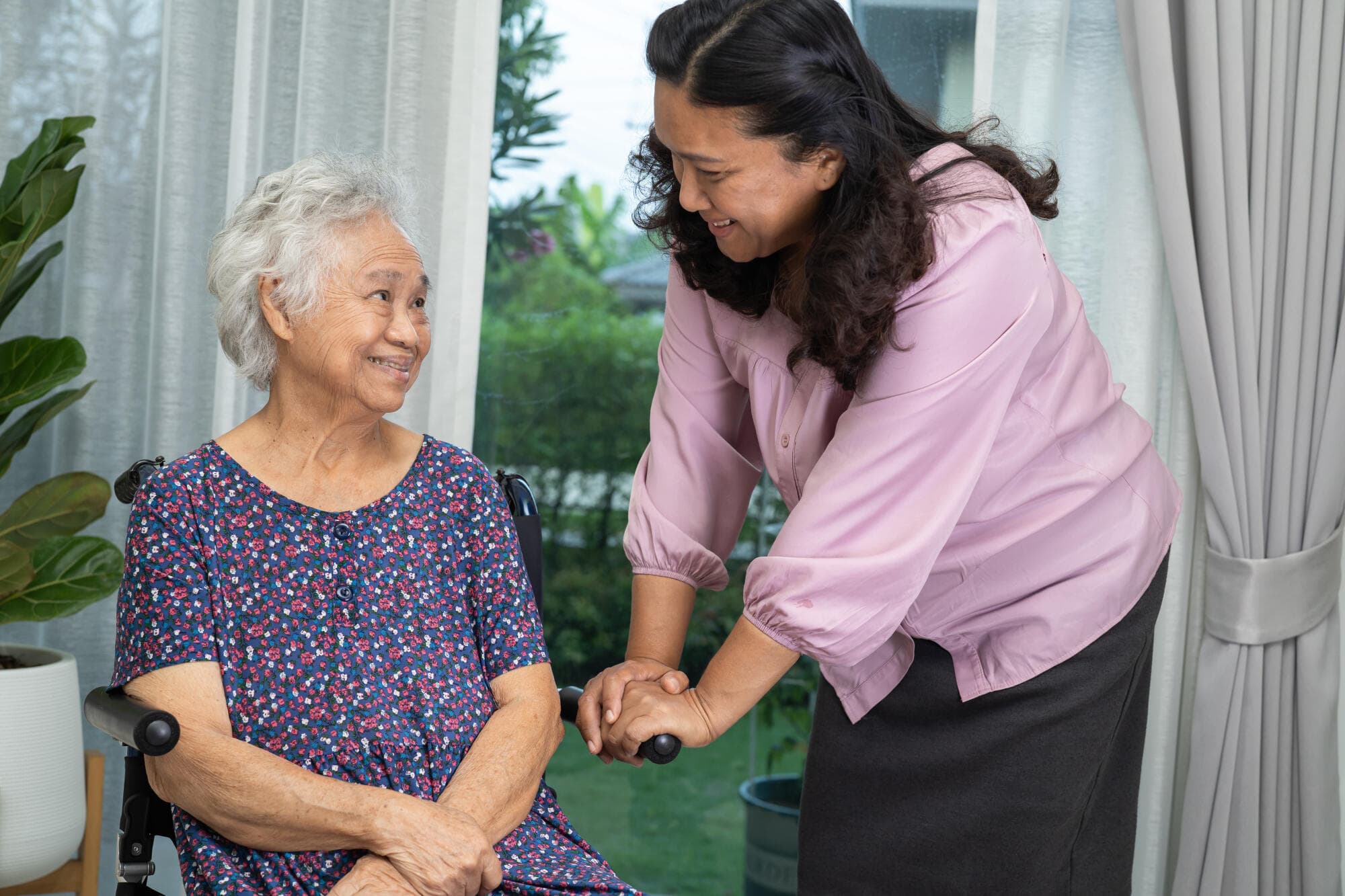 Compassionate caregiver helping a senior at home